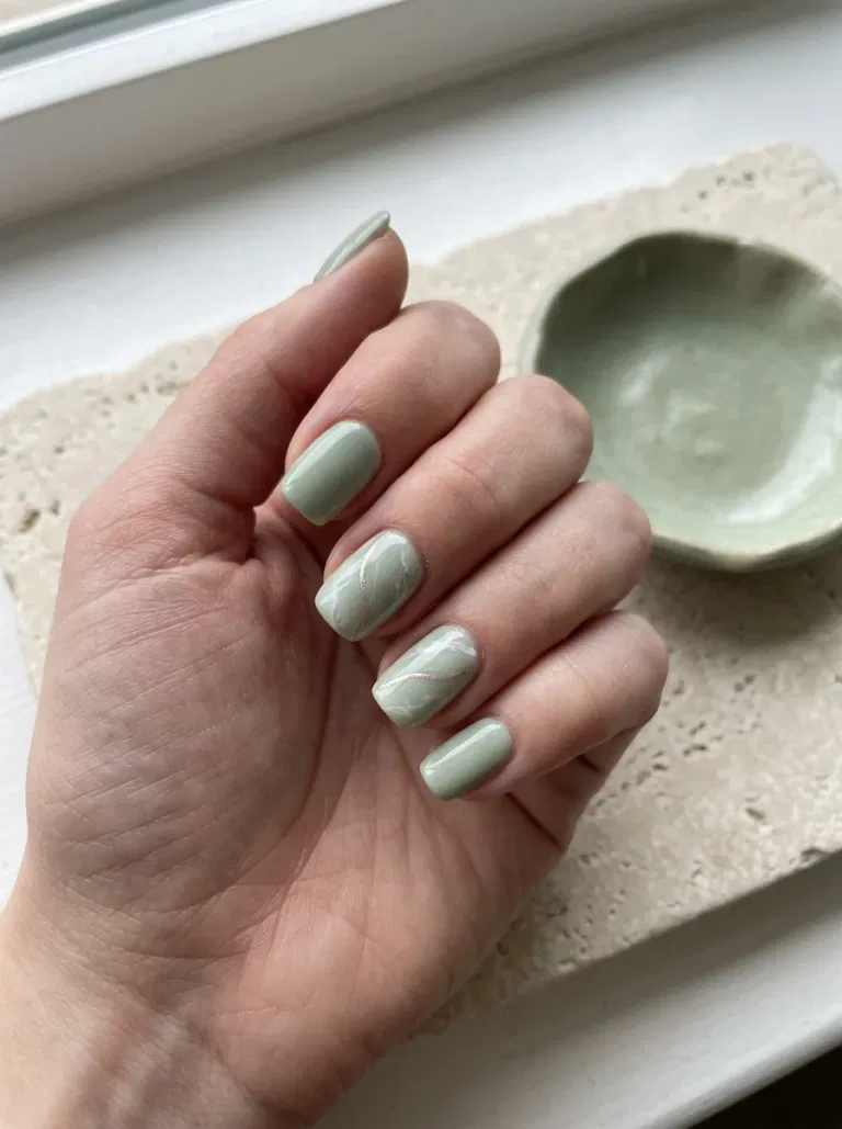 Sage Marble with a Champagne Vein nail design