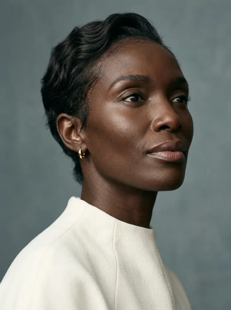 Black woman wearing a soft tapered wavy pixie hairstyle