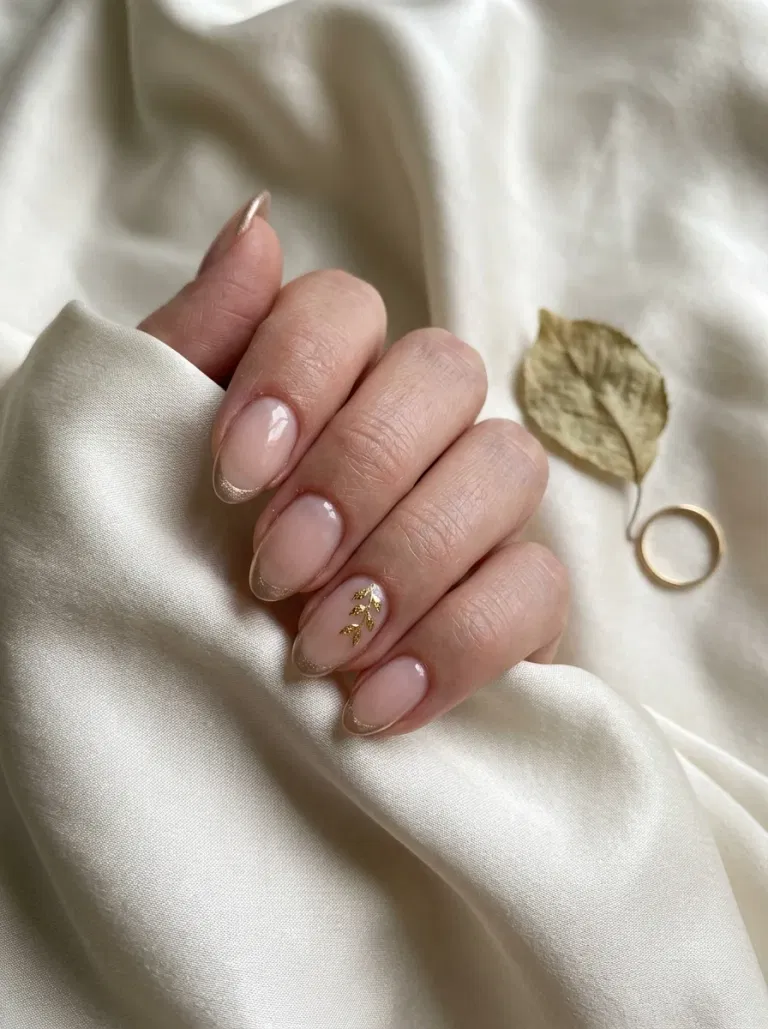 Champagne Chrome Leaf French nail design